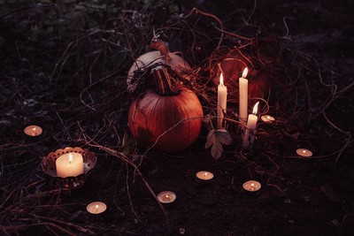 Pumpkin, candles and animal skull