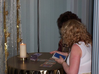 Two people at a table conducting a Tarot Reading